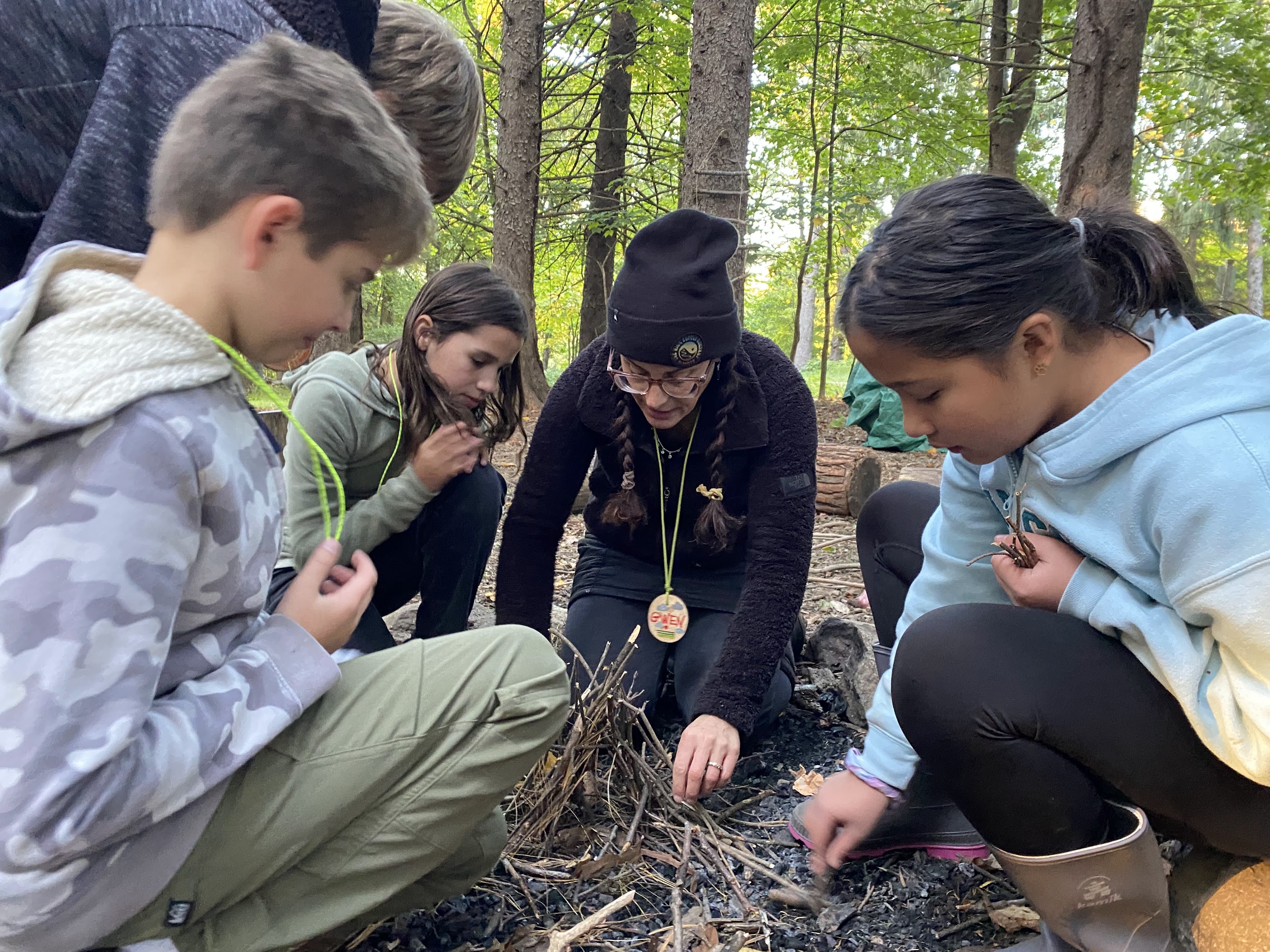 Wayfinders participants gathered around a fire